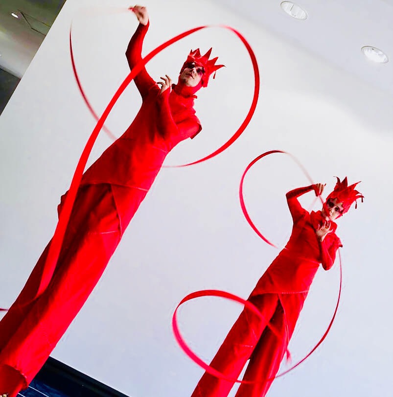 Red Ribbon | Ribbon Twirling on Stilts, stilt walker in Brisbane