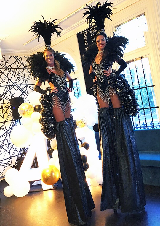Black Showgirl Stilt Walkers, roving entertainer in Melbourne