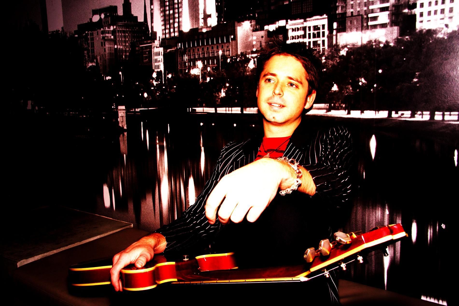 Josh J, acoustic guitar and singer solo in Perth