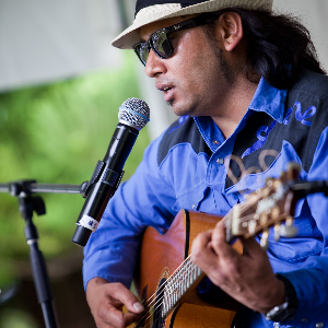 Ajay Goldsmith, acoustic guitar and singer solo in Sydney